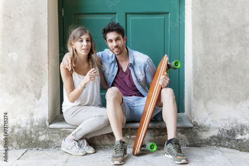 young couple of skateborder in relax photo