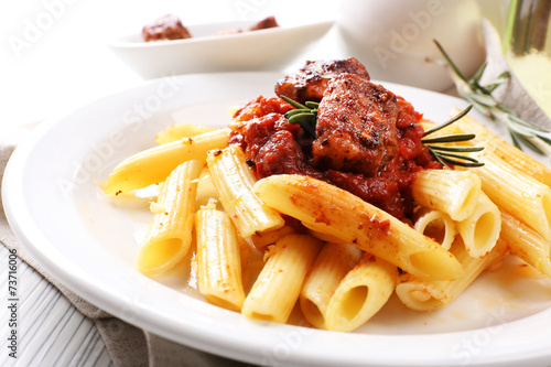 Tasty pasta with meat on table