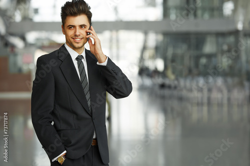 Businessman Talking on the Phone and Smiling