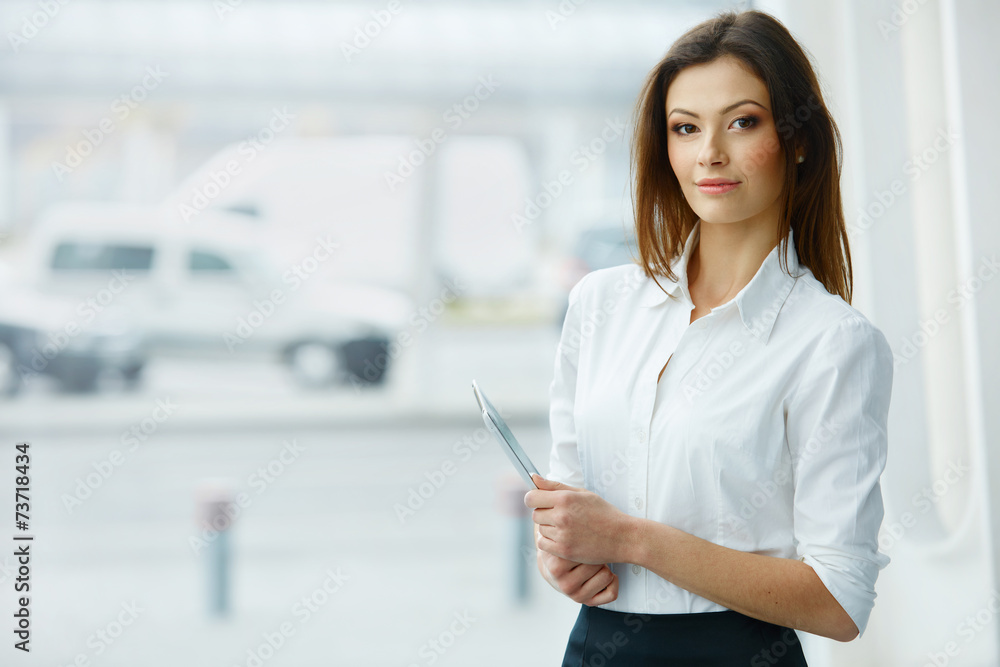 Business Woman Holding a Tablet Computer. - obrazy, fototapety, plakaty 