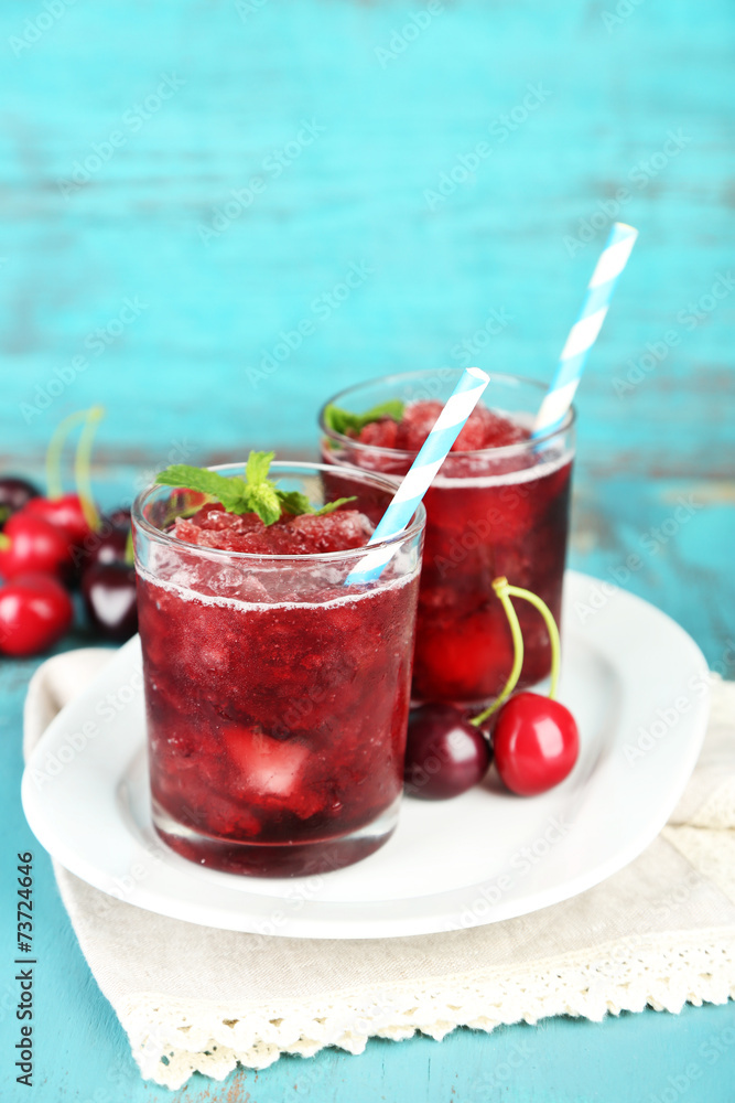 Closeup of cherry granita in glasses, on color wooden Closeup of cherry granita in glasses, on color wooden