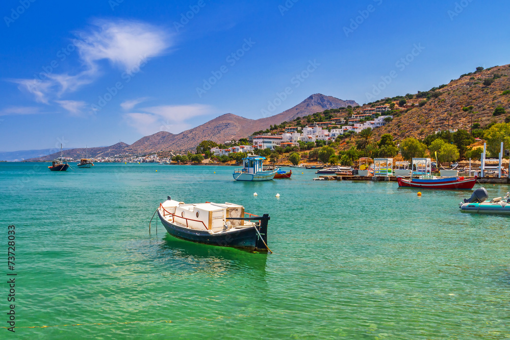 Fishing boats on the blue lagoon of Crete, Greece