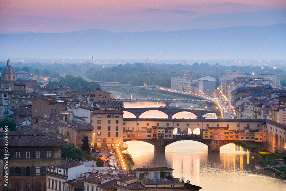 Colorful sunset over Ponte Vecchio on Arno River, Florence, Ital