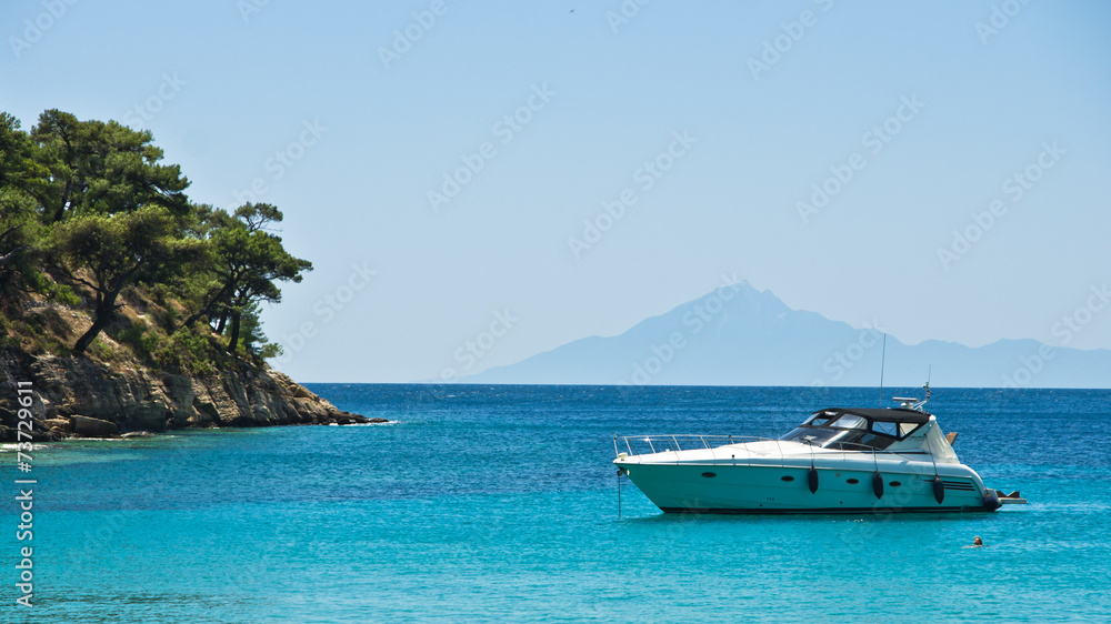 Boat anchored in a small bay at Thassos island