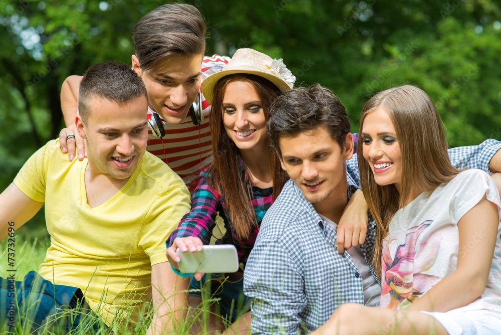 Friends Taking a Photo with Smartphone Friends Taking a Photo with Smartphone