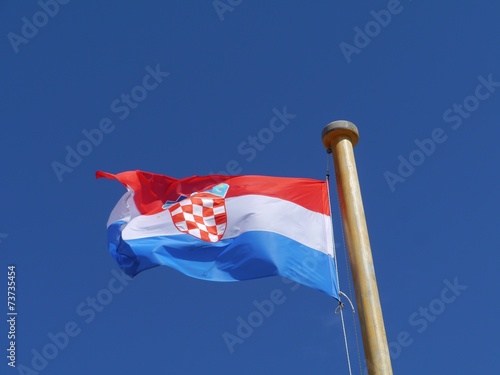 The Crotian flag blowing in the wind photo