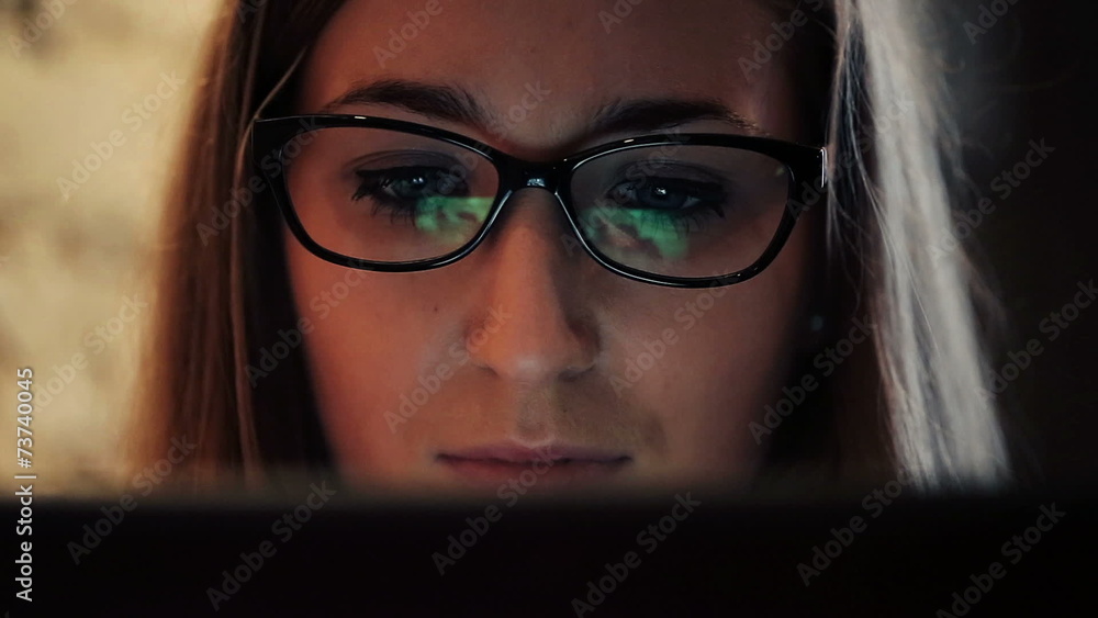 Closeup shot of woman face surfing internet on tablet computer Closeup shot of woman face surfing internet on tablet computer