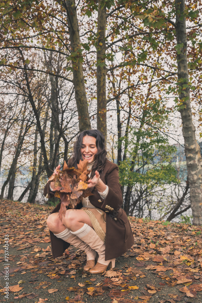 Beautiful young woman posing in a city park Beautiful young woman posing in a city park