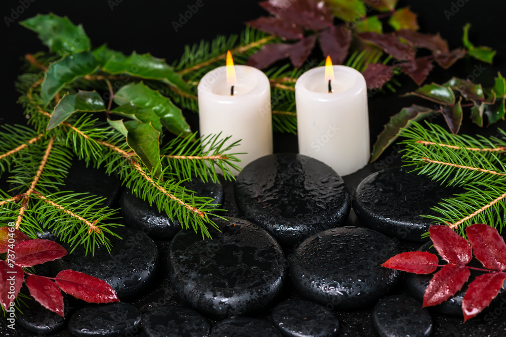 winter spa concept of zen basalt stones with drops, candles and winter spa concept of zen basalt stones with drops, candles and
