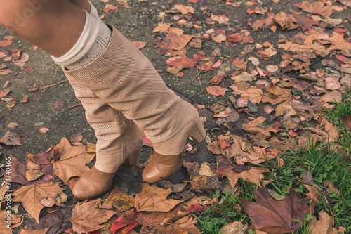 Detail of a beautiful young woman posing in a city park