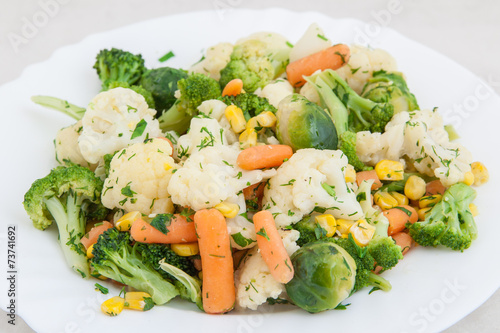 cooked vegetables in white plate photo