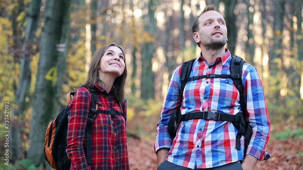 Young couple admiring view of the autumn forest Young couple admiring view of the autumn forest