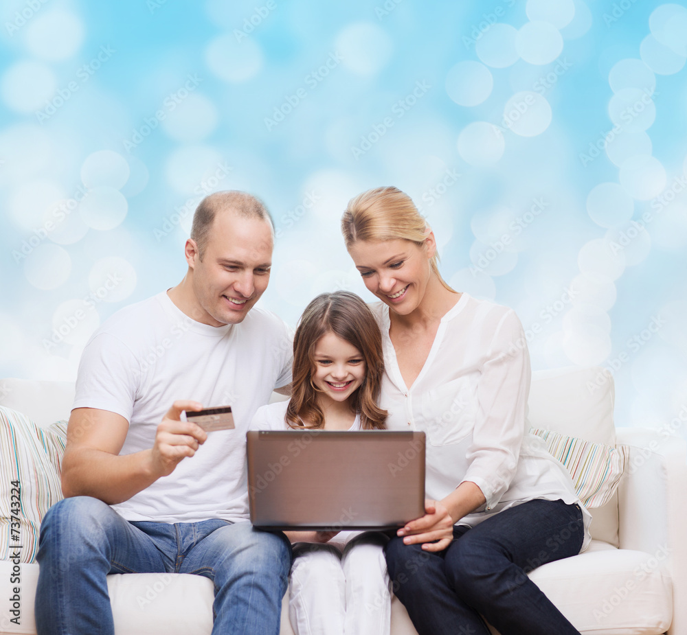happy family with laptop computer and credit card happy family with laptop computer and credit card