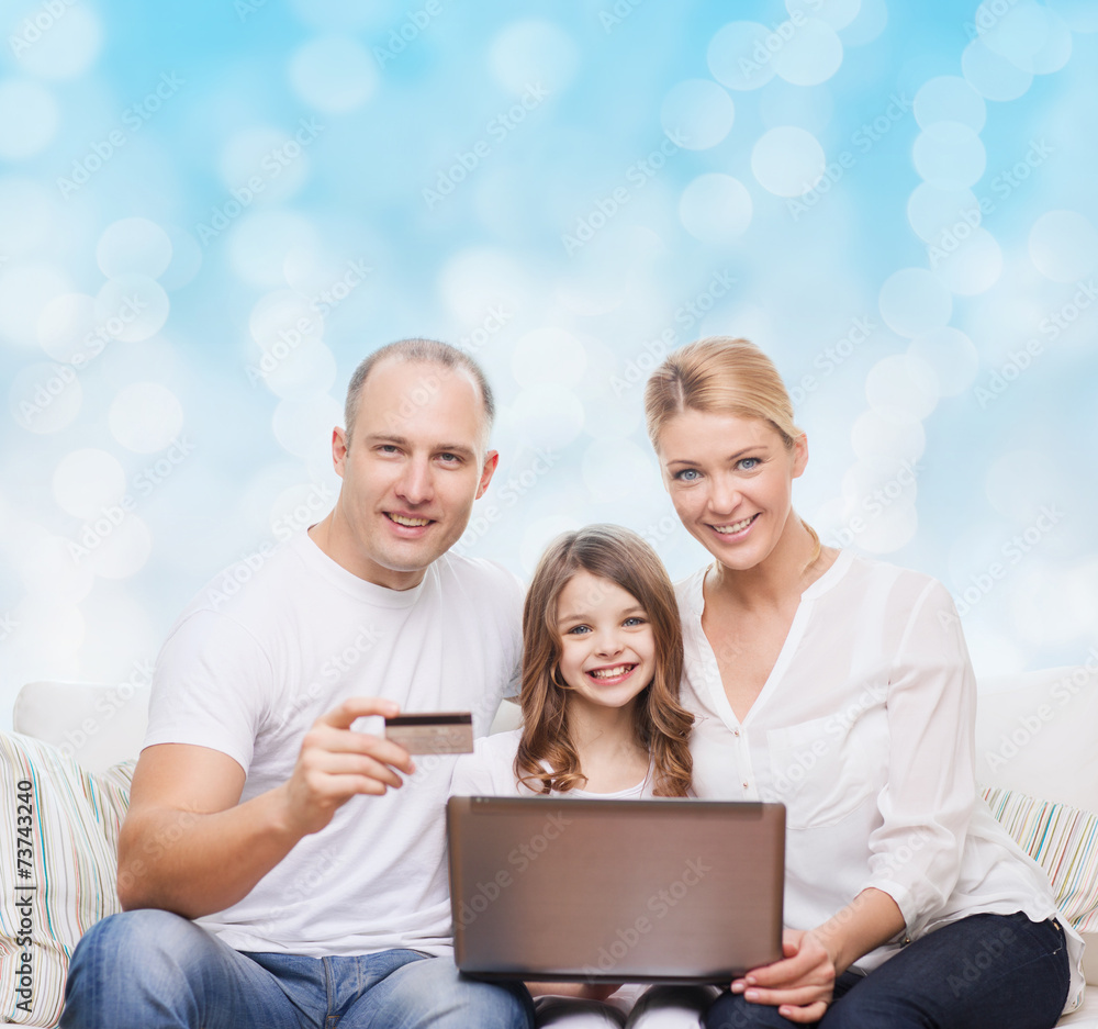 happy family with laptop computer and credit card happy family with laptop computer and credit card