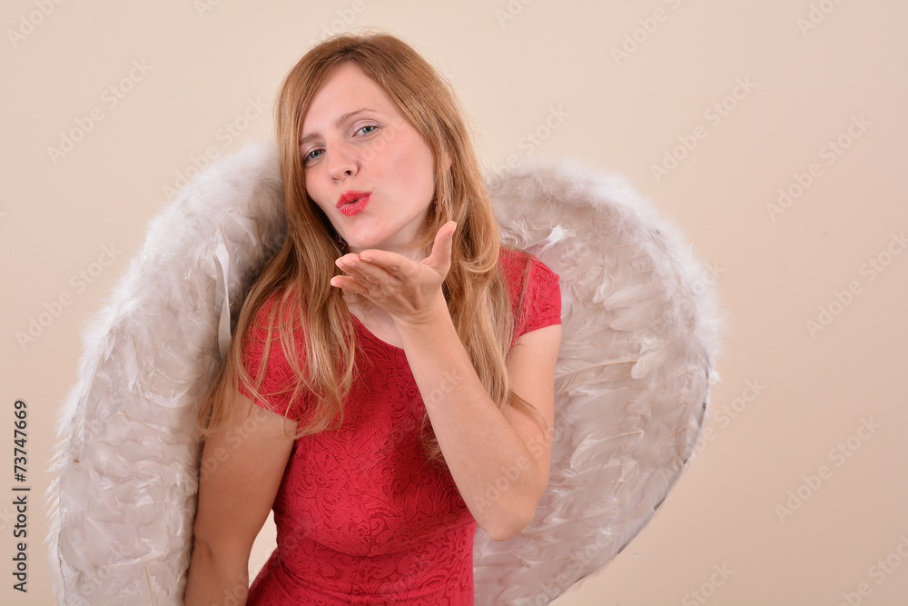 Pretty blonde girl angel with white wings Pretty blonde girl angel with white wings