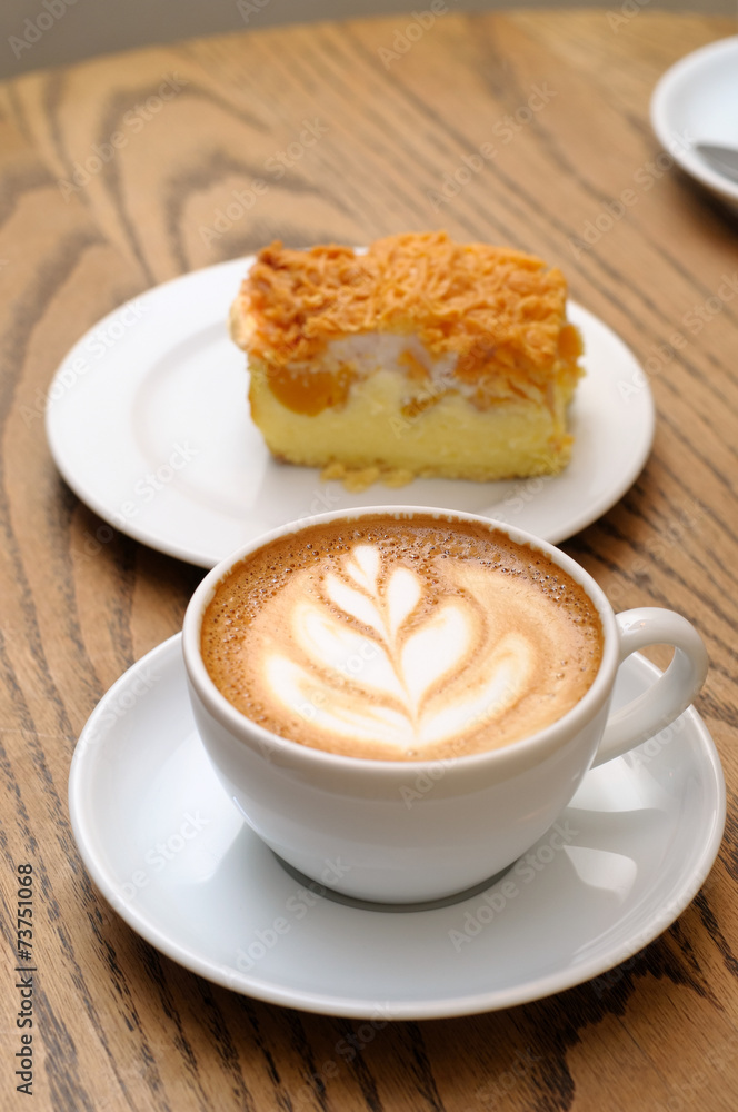 cappuccino cup with cake