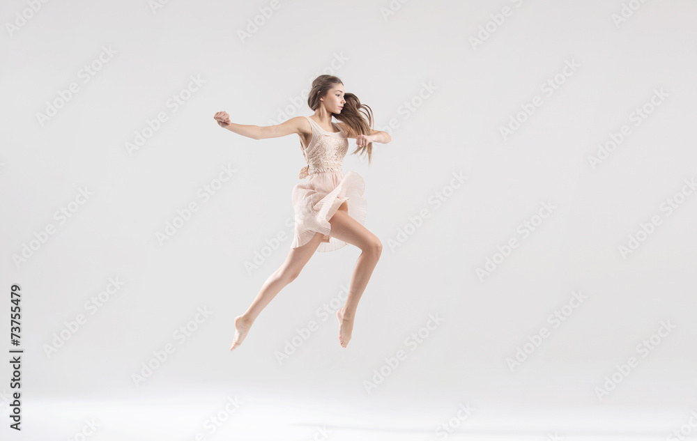 Talented ballet dancer in athletic jump