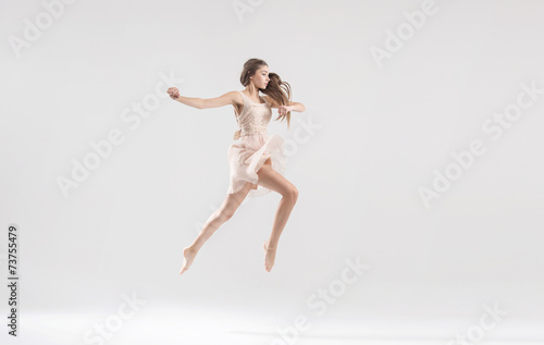 Talented ballet dancer in athletic jump