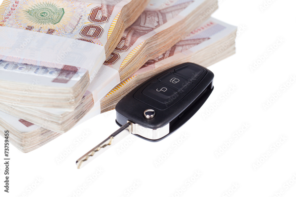 Car key and banknotes,Isolated on white background Car key and banknotes,Isolated on white background
