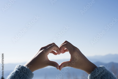 Hands are making the shape of a heart photo