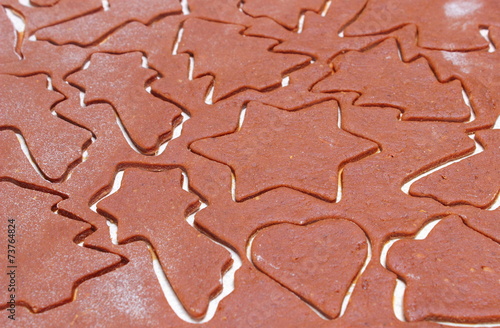 Dough for cookies in shape of christmas tree and star