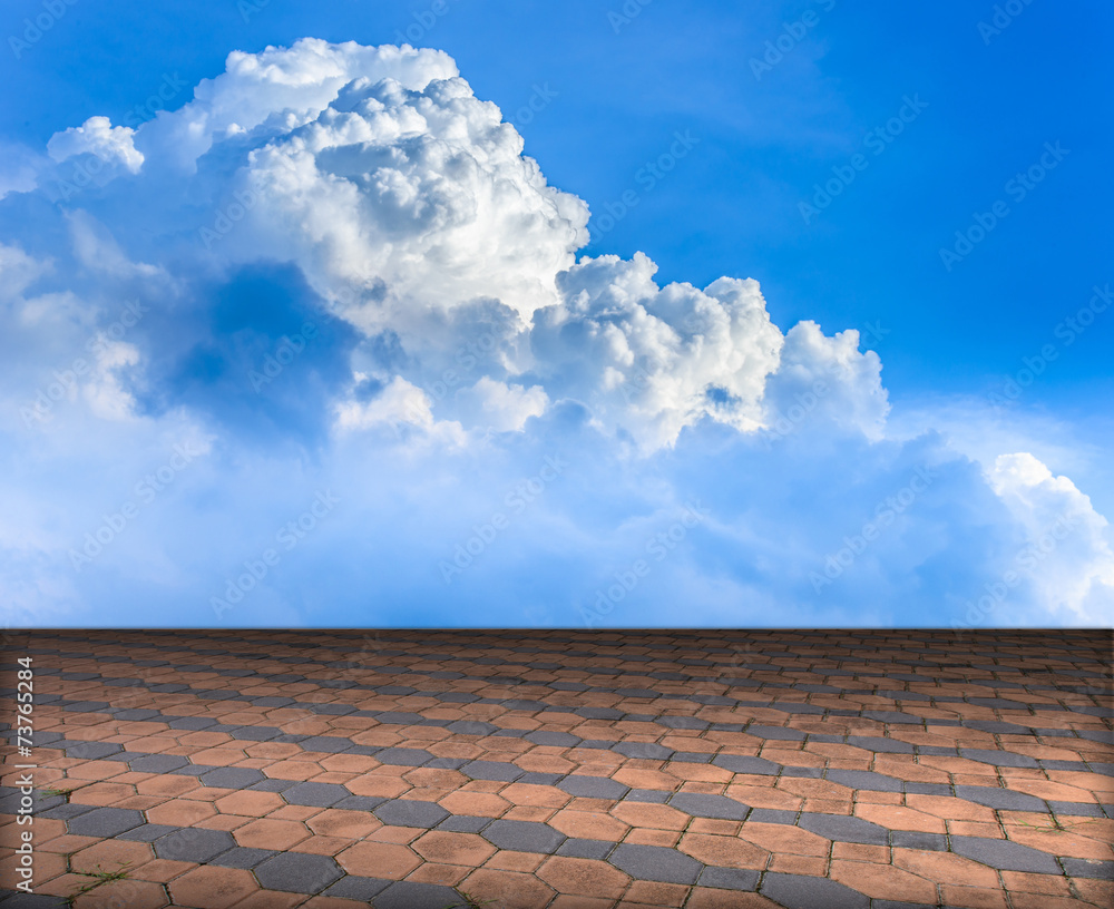 Cement brick floor with cloud and blue sky