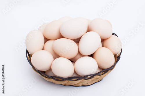 Wallpaper Mural Eggs in basket isolated on white background Torontodigital.ca