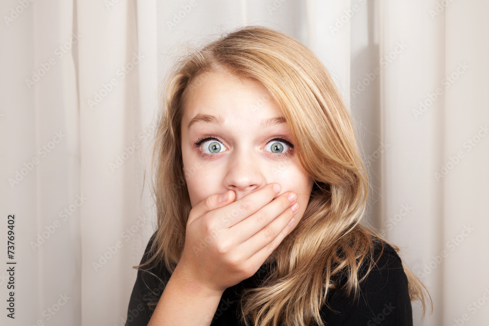 Beautiful blond surprised girl opened her eyes wide Beautiful blond surprised girl opened her eyes wide