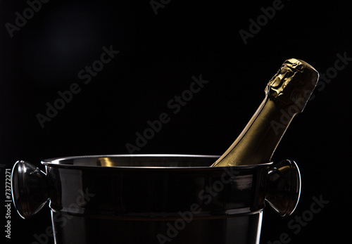 Champagne bucket on black background
