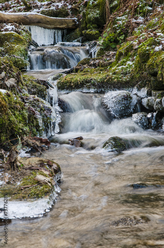 Small creek with a waterfall close up