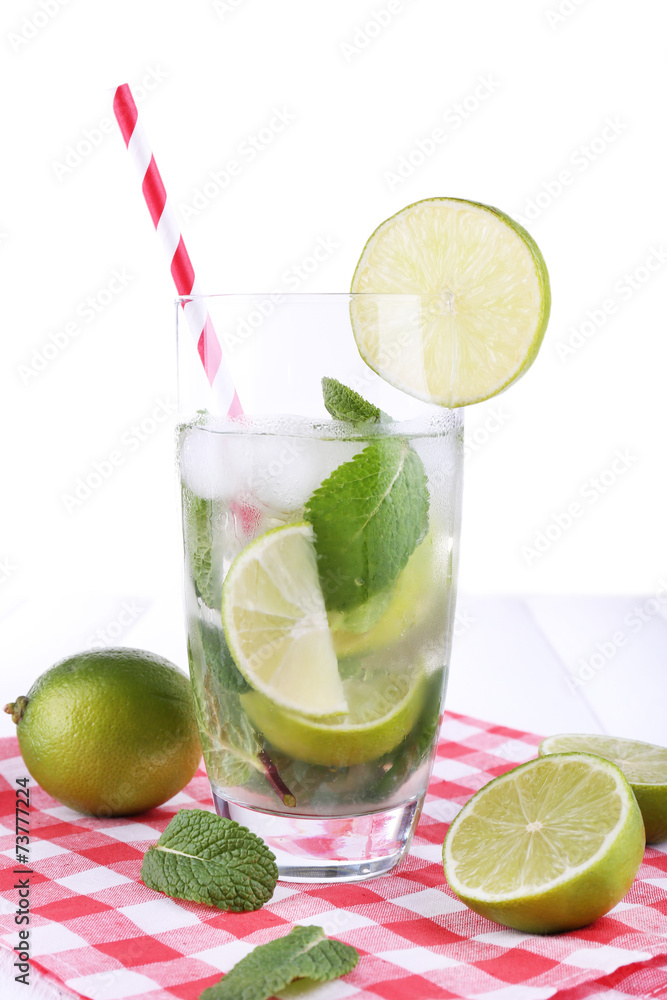 Lemonade in glass on napkin on bright background Lemonade in glass on napkin on bright background