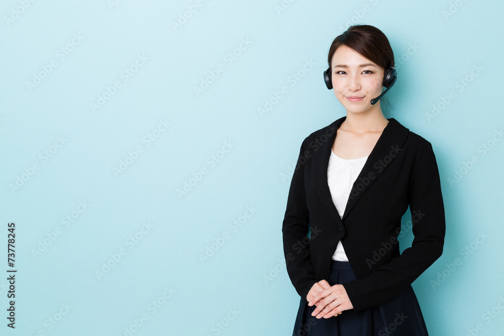 portrait of asian operator on blue background portrait of asian operator on blue background