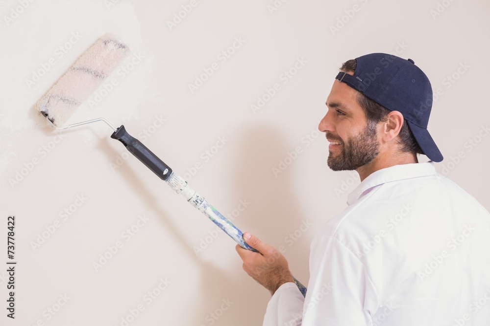 Painter painting the walls white Painter painting the walls white