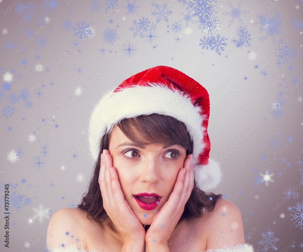Composite image of pretty santa girl with hands on face Composite image of pretty santa girl with hands on face