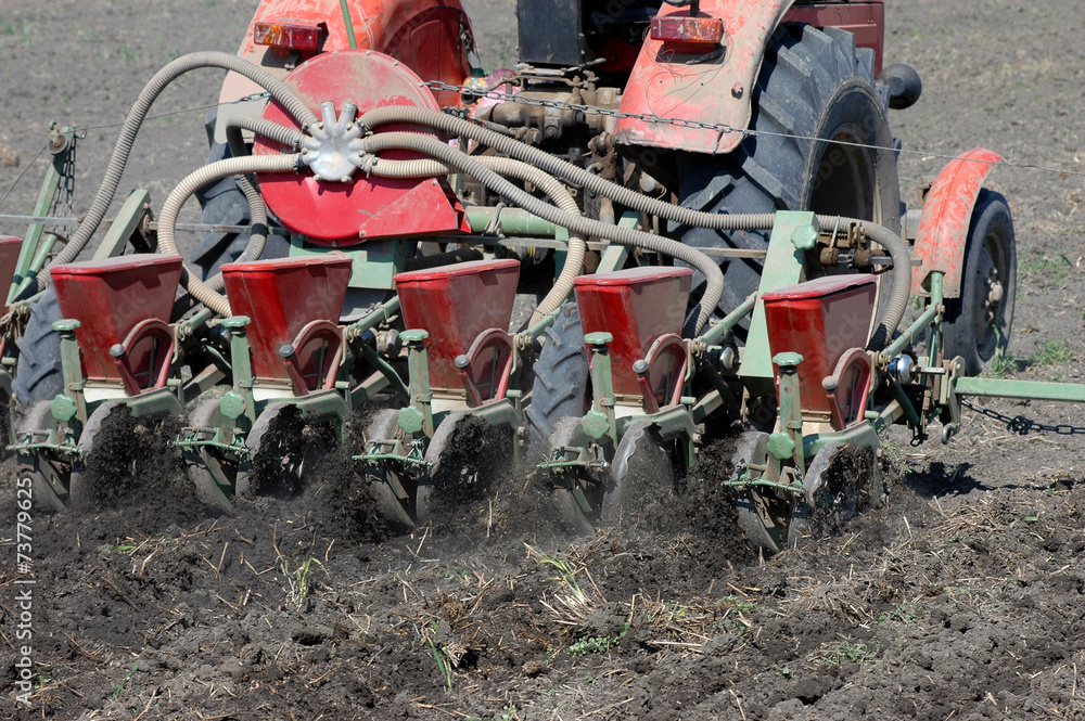 Sowing a field with a tractor Sowing a field with a tractor