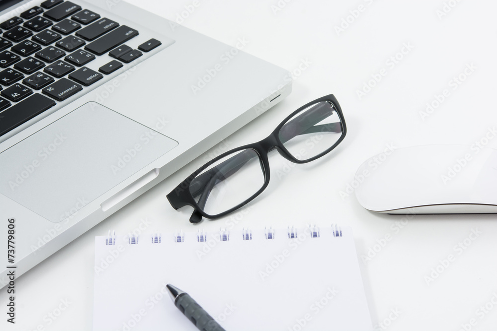 Blank business laptop, mouse, pen, glasses and note Blank business laptop, mouse, pen, glasses and note
