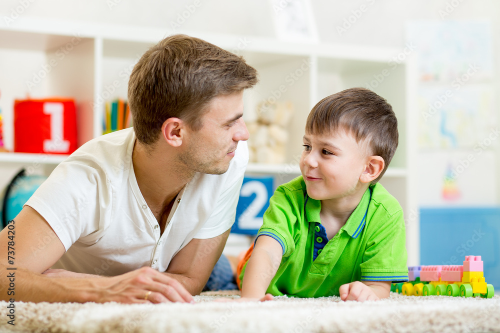 man with his kid son play together man with his kid son play together