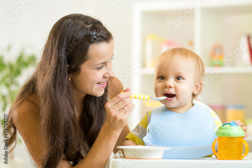 Beautiful young woman feeds...