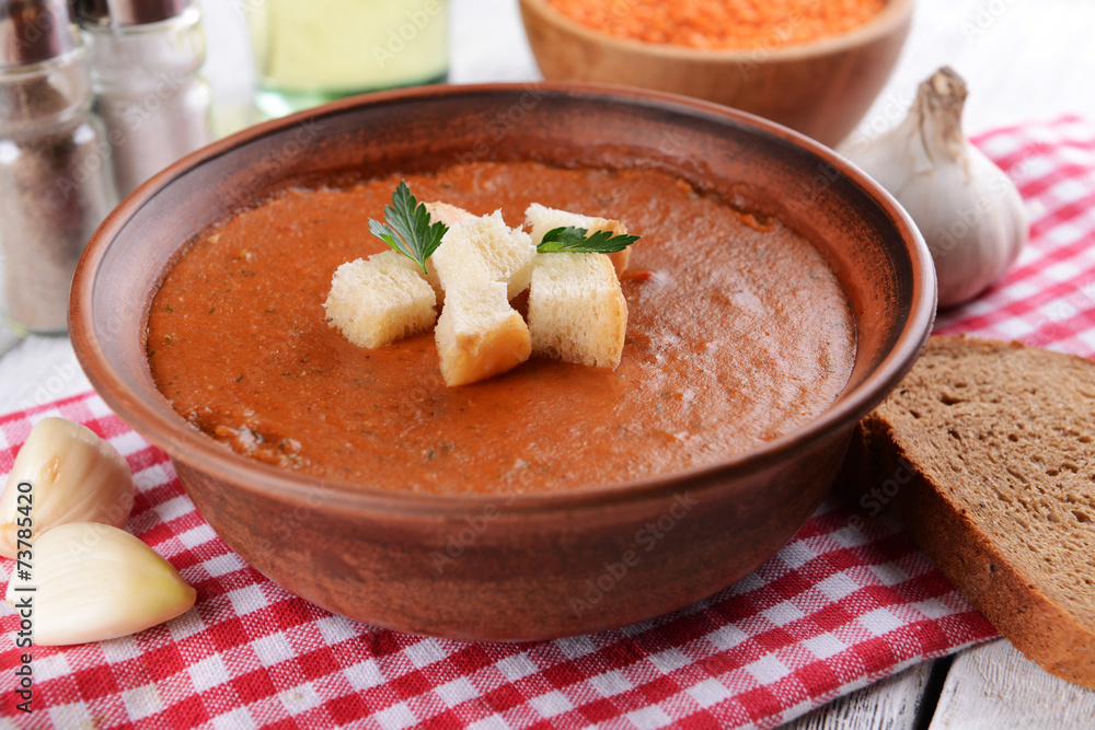 Delicious lentil cream-soup on table close-up Delicious lentil cream-soup on table close-up