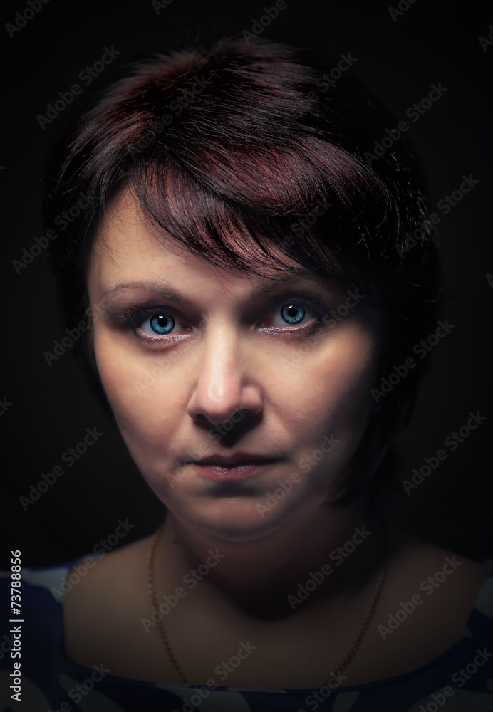 portrait of a woman with a serious look portrait of a woman with a serious look