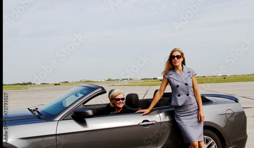 Two women, one in convertible