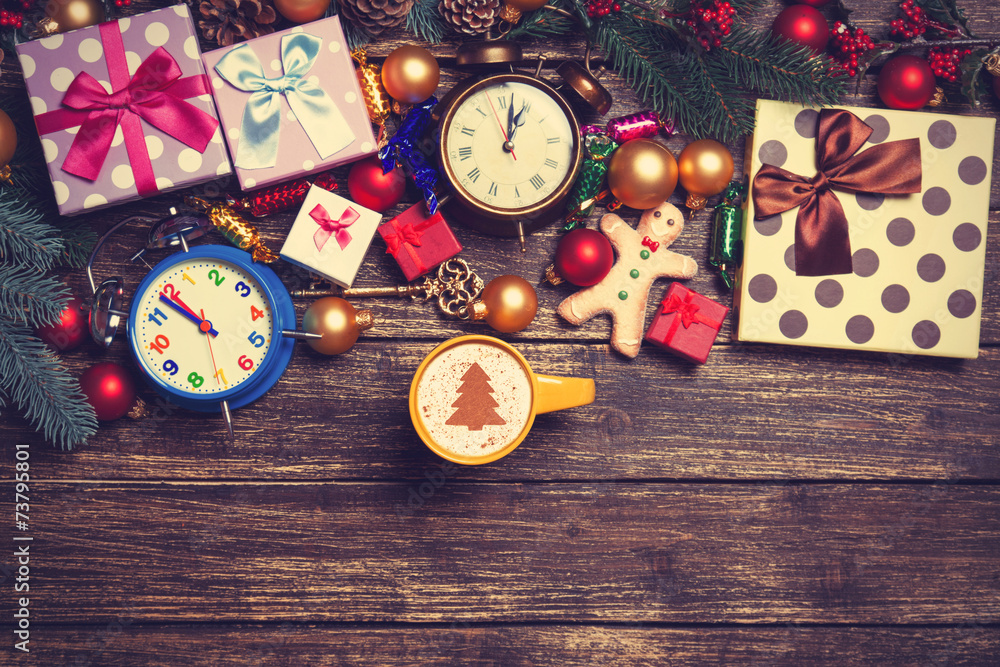 Gifts, cup of coffee and pine branch on a wooden table. Gifts, cup of coffee and pine branch on a wooden table.