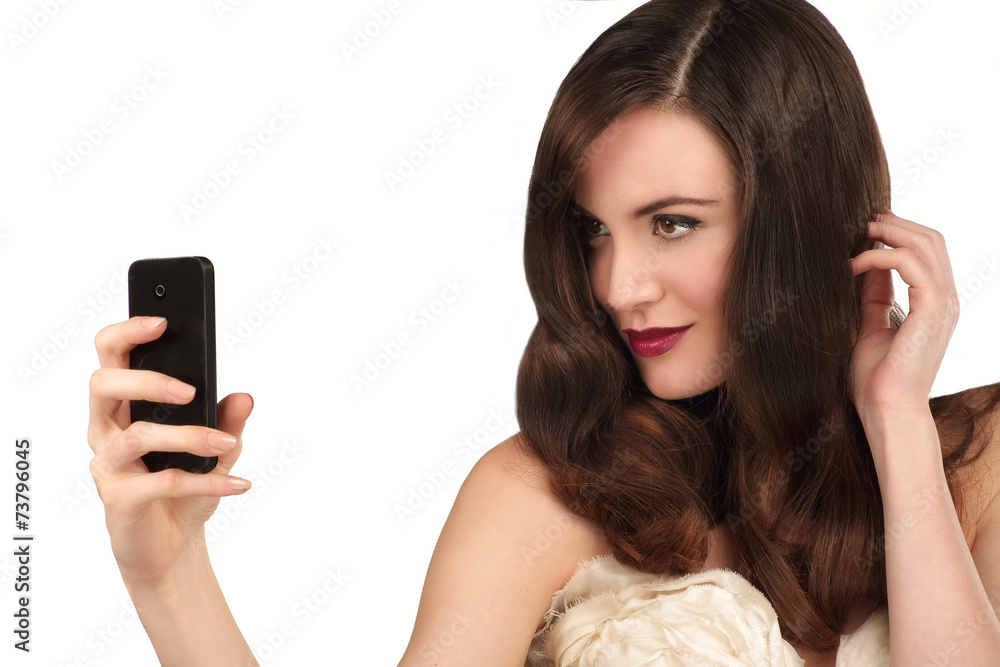 Beautiful woman taking a selfie with smartphone Beautiful woman taking a selfie with smartphone