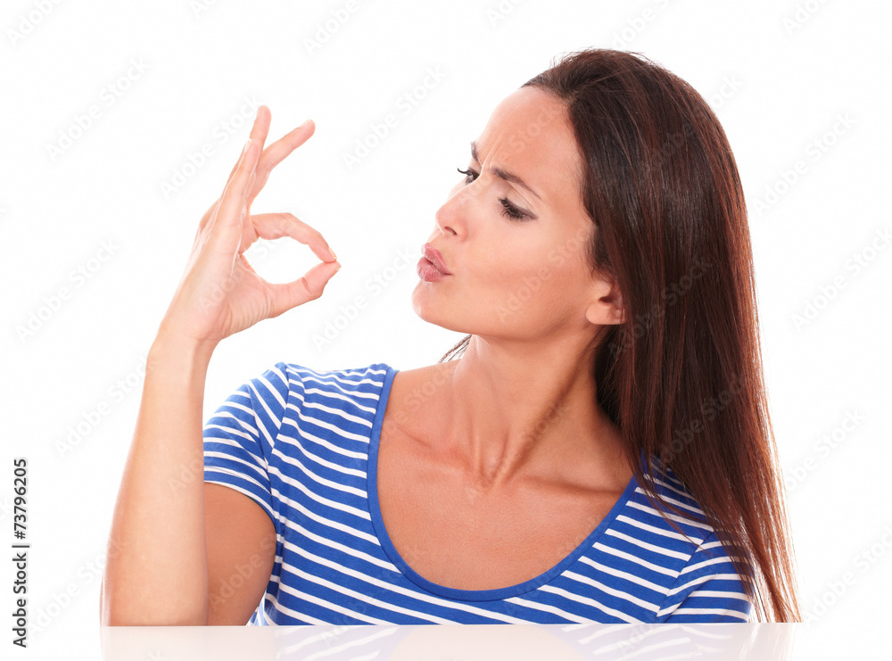 Pretty woman looking to her hand Pretty woman looking to her hand