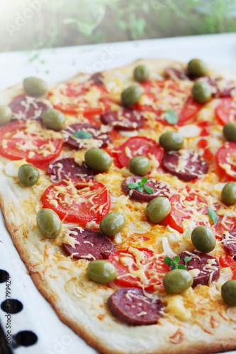 pizza with sausage and olives