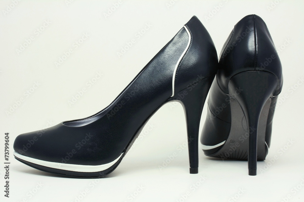 Black shoes with white stripes. Black shoes with white stripes.