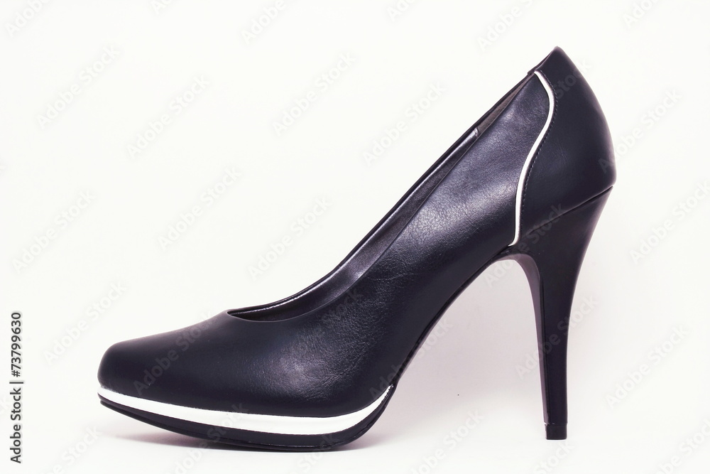 Black elegant shoe with white stripes. Black elegant shoe with white stripes.