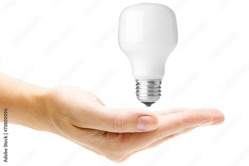 Energy saving light bulb in hand Energy saving light bulb in hand