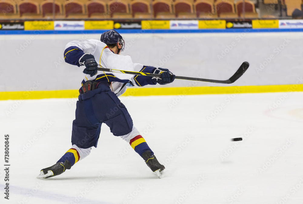 Naklejka premium Ice Hockey - Player makes a slapshot