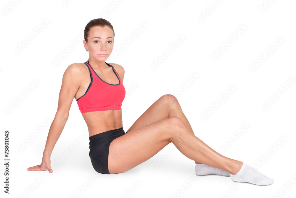 Beautiful fitness woman with perfect body sitting. Isolated Beautiful fitness woman with perfect body sitting. Isolated